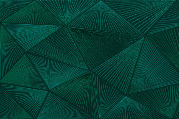 Disegno a triangolo verde su una superficie verde Disegno a triangolo verde su una superficie verde