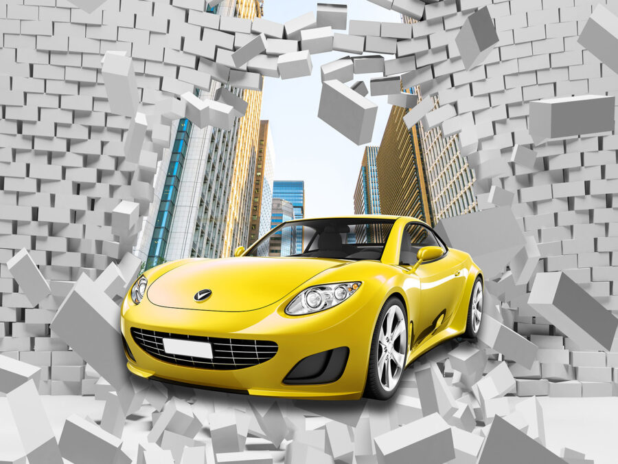 Auto gialla in un muro di mattoni Auto gialla in un muro di mattoni