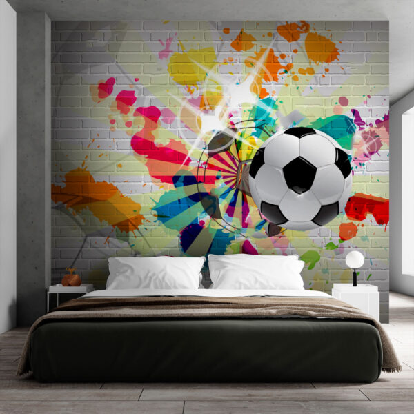 Pallone da calcio su un muro di mattoni Pallone da calcio su un muro di mattoni