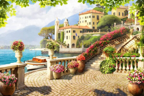 Passerella in pietra con scale e fiori sul lato dell'acqua Passerella in pietra con scale e fiori sul lato dell'acqua