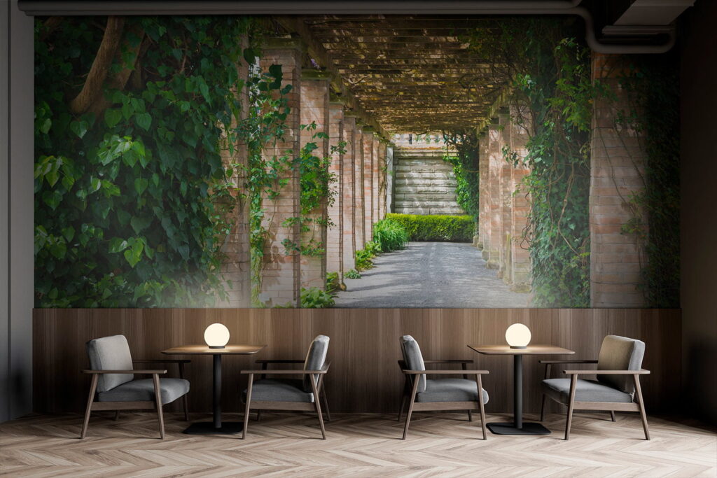 Walkway with stone pillars and vines