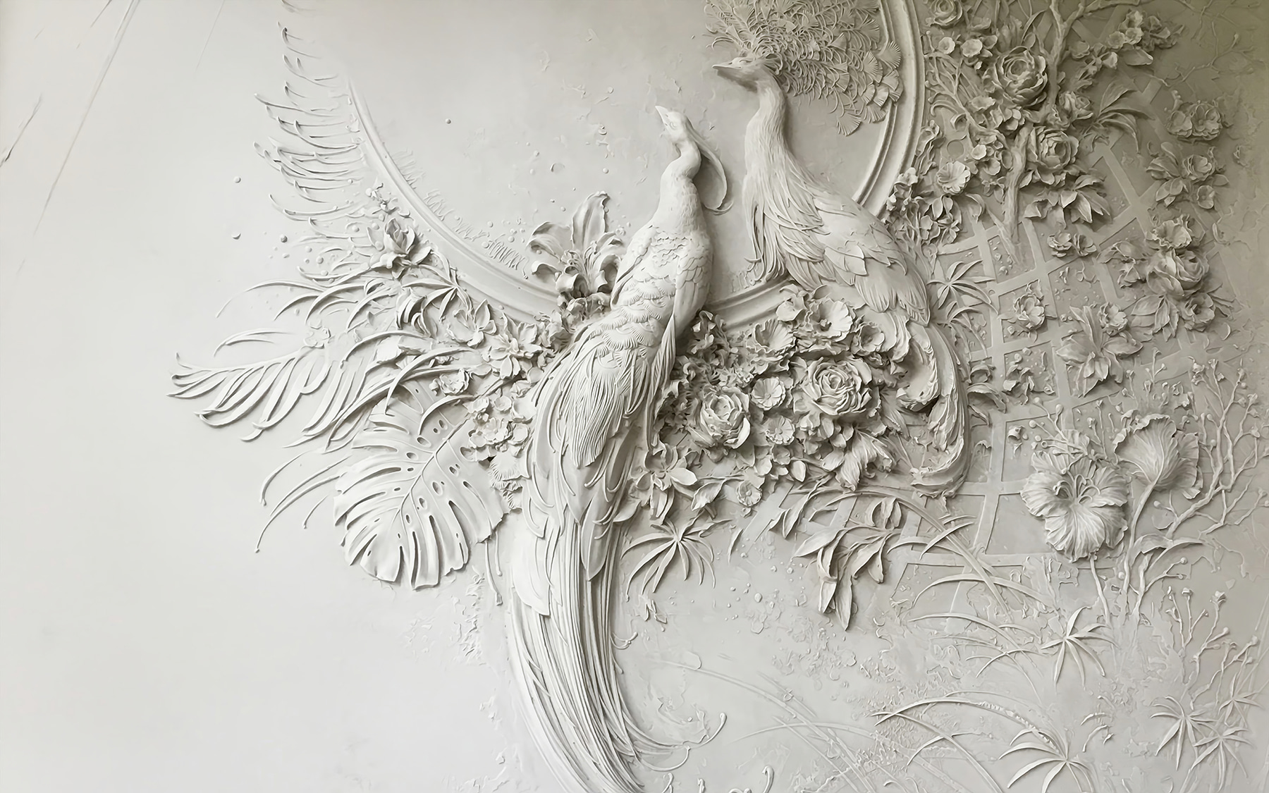 White wall with a couple of birds and flowers