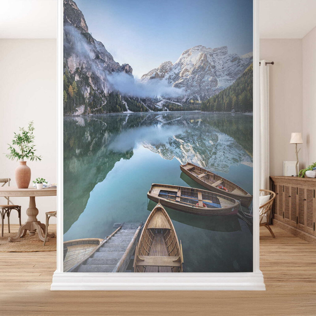 Boats on a lake with mountains in the background Boats on a lake with mountains in the background