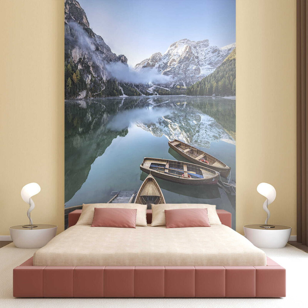 Boats on a lake with mountains in the background Boats on a lake with mountains in the background