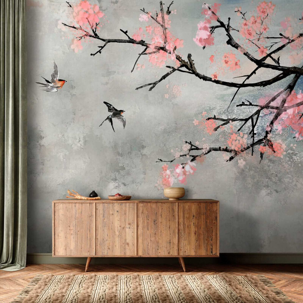 Tree branch with pink flowers and birds flying