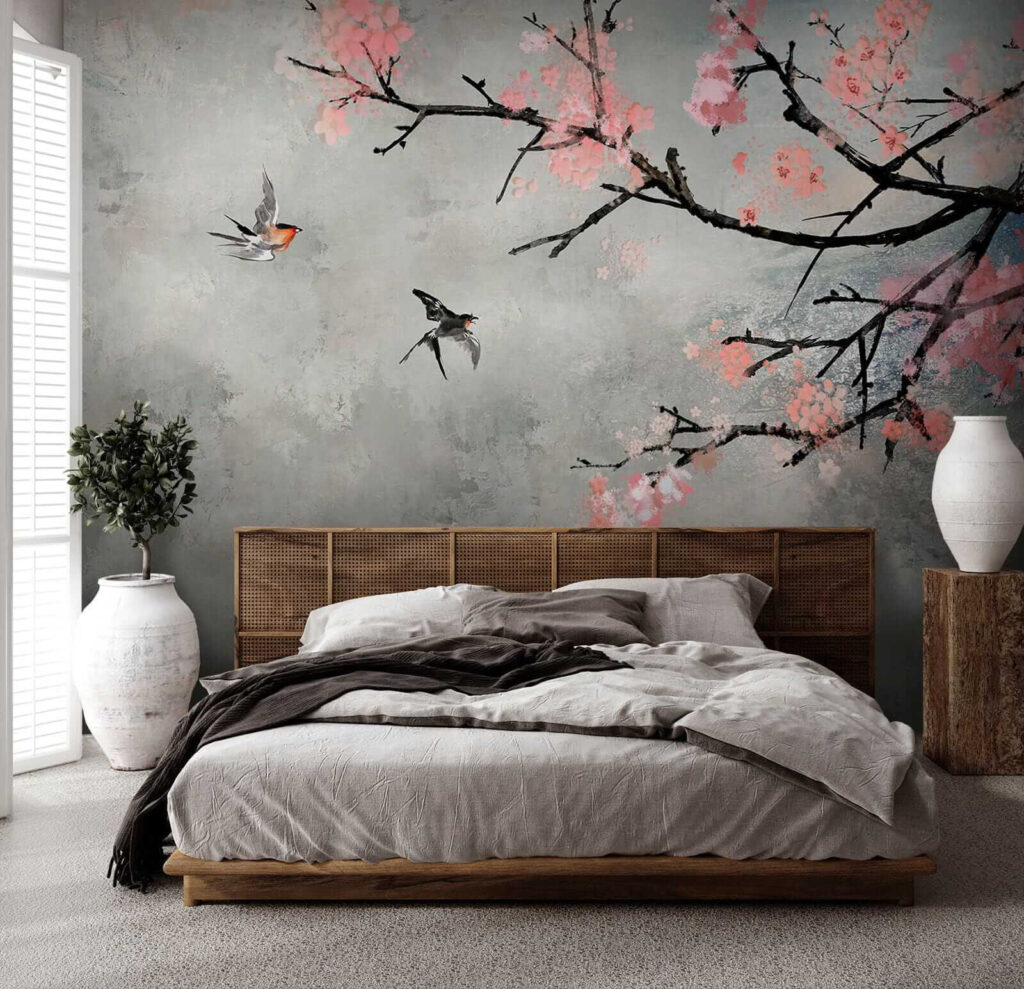 Tree branch with pink flowers and birds flying