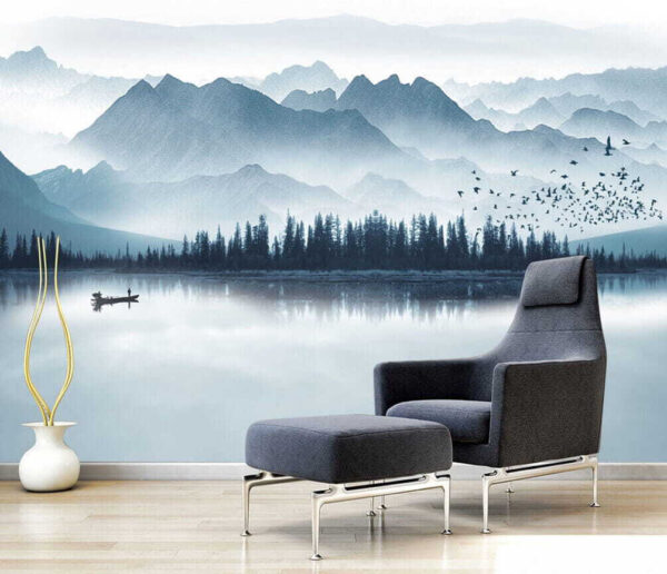 Person in a boat on a lake with mountains in the background Person in a boat on a lake with mountains in the background