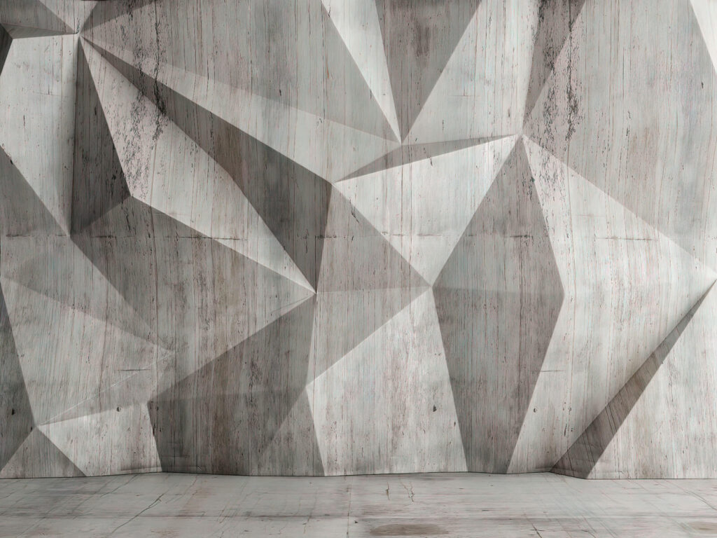 Un muro di cemento con un motivo triangolare Un muro di cemento con un motivo triangolare