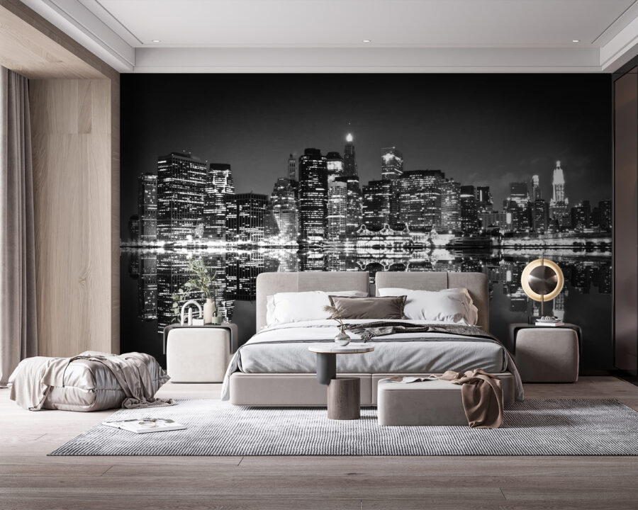 Lo skyline della città di notte con le luci che si riflettono sull'acqua Lo skyline della città di notte con le luci che si riflettono sull'acqua