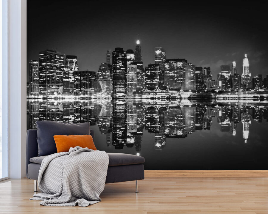 Lo skyline della città di notte con le luci che si riflettono sull'acqua Lo skyline della città di notte con le luci che si riflettono sull'acqua
