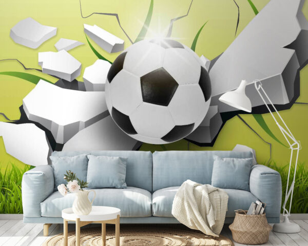 Pallone da calcio che sfonda un muro Pallone da calcio che sfonda un muro