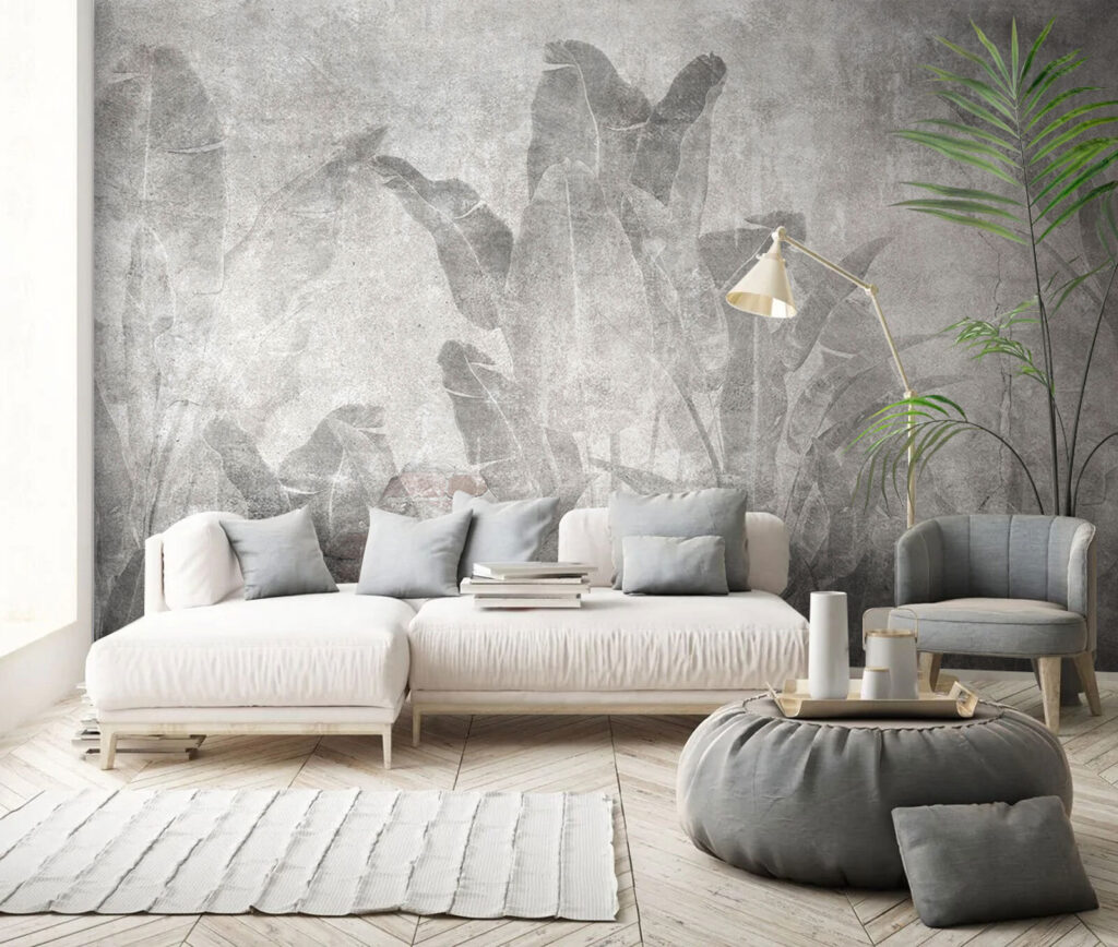 Grey wall with leaves and a brick wall