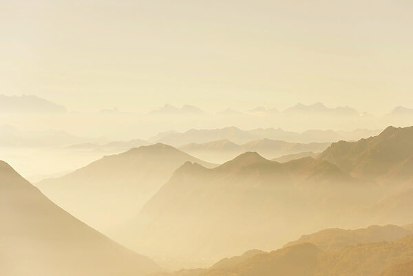 A mountain range with fog A mountain range with fog