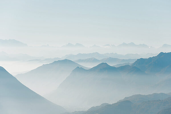 A mountain range with fog A mountain range with fog