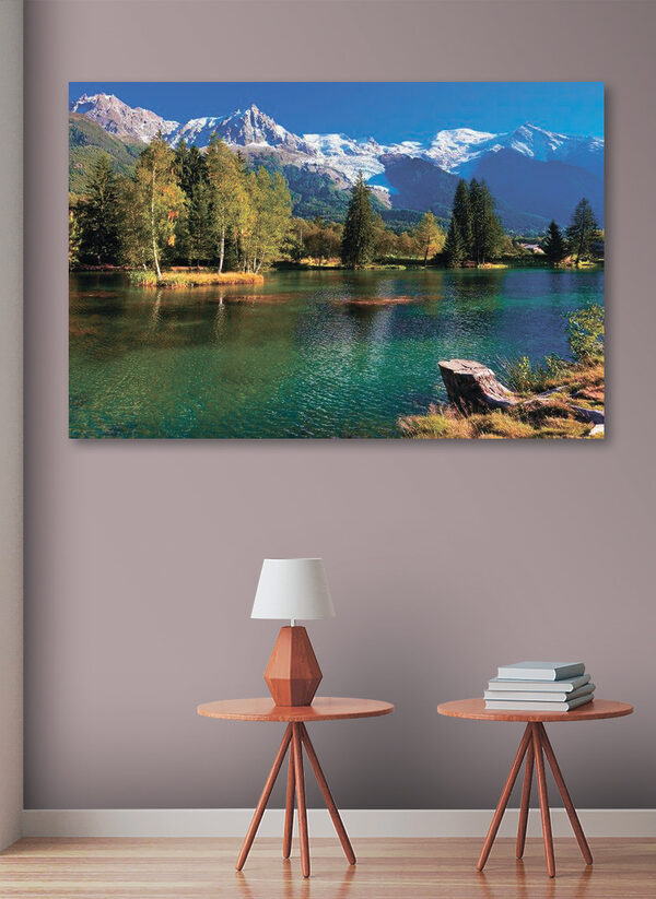 A lake surrounded by trees and mountains A lake surrounded by trees and mountains