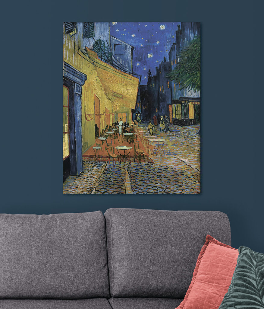 A painting of a street with tables and chairs