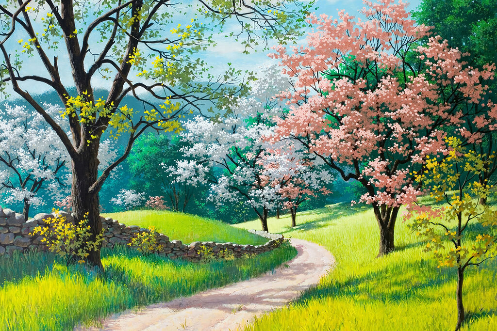 A dirt road through a grassy field with trees and a stone wall
