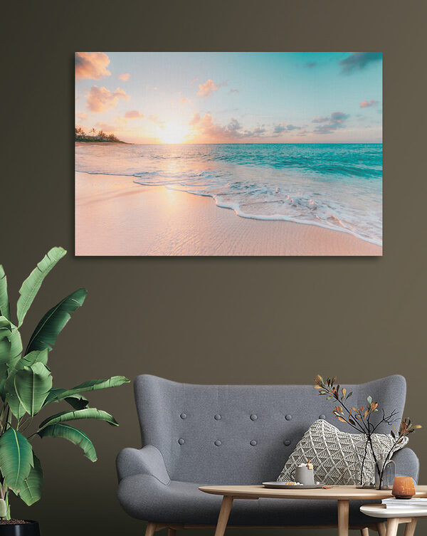 A beach with waves and a sunset