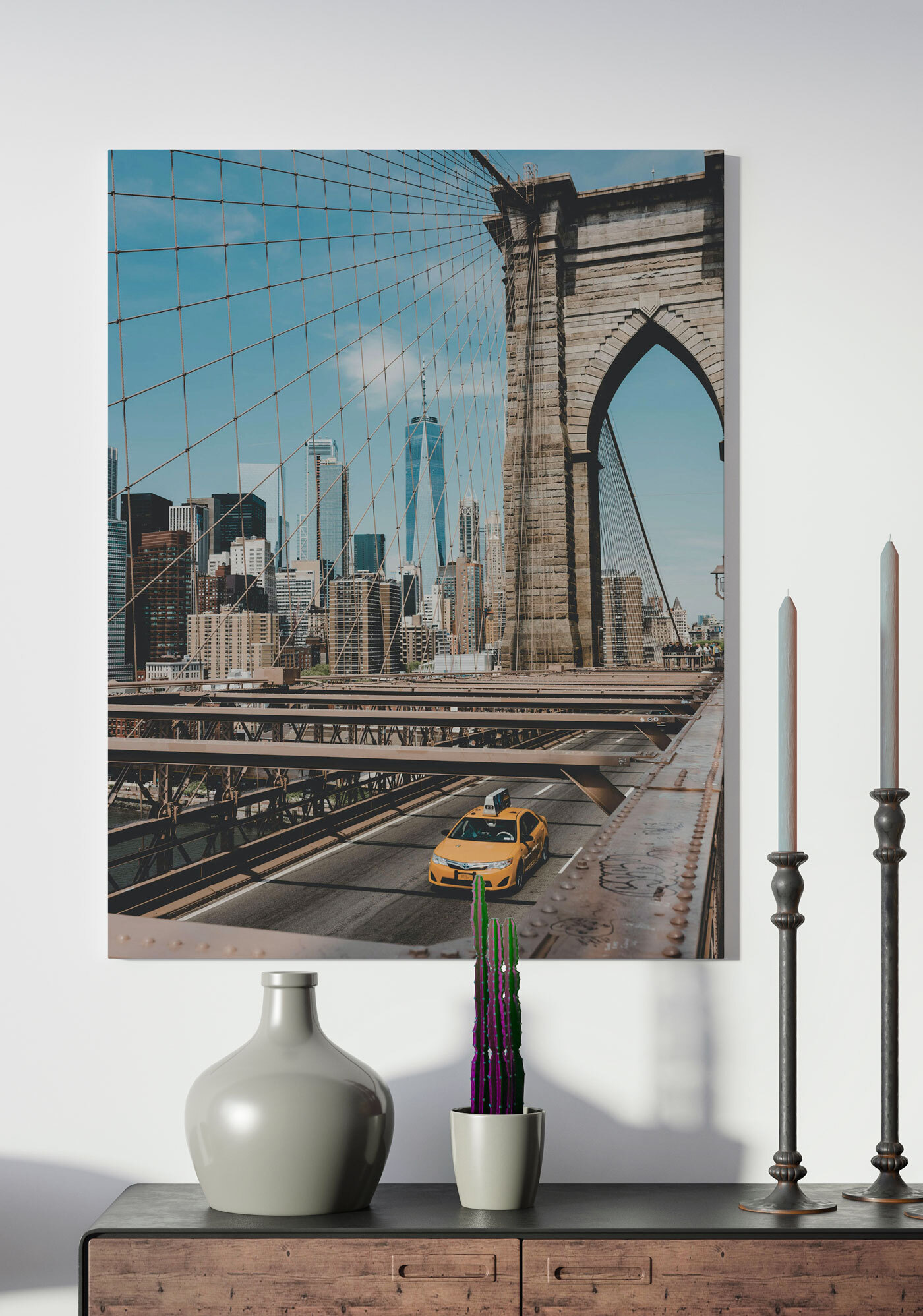 Brooklyn Bridge with a yellow taxi driving down it Brooklyn Bridge with a yellow taxi driving down it