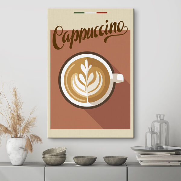 Quadri Una tazza di caffè con un disegno a forma di foglia nella schiuma