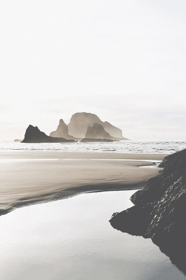 A beach with rocks and water