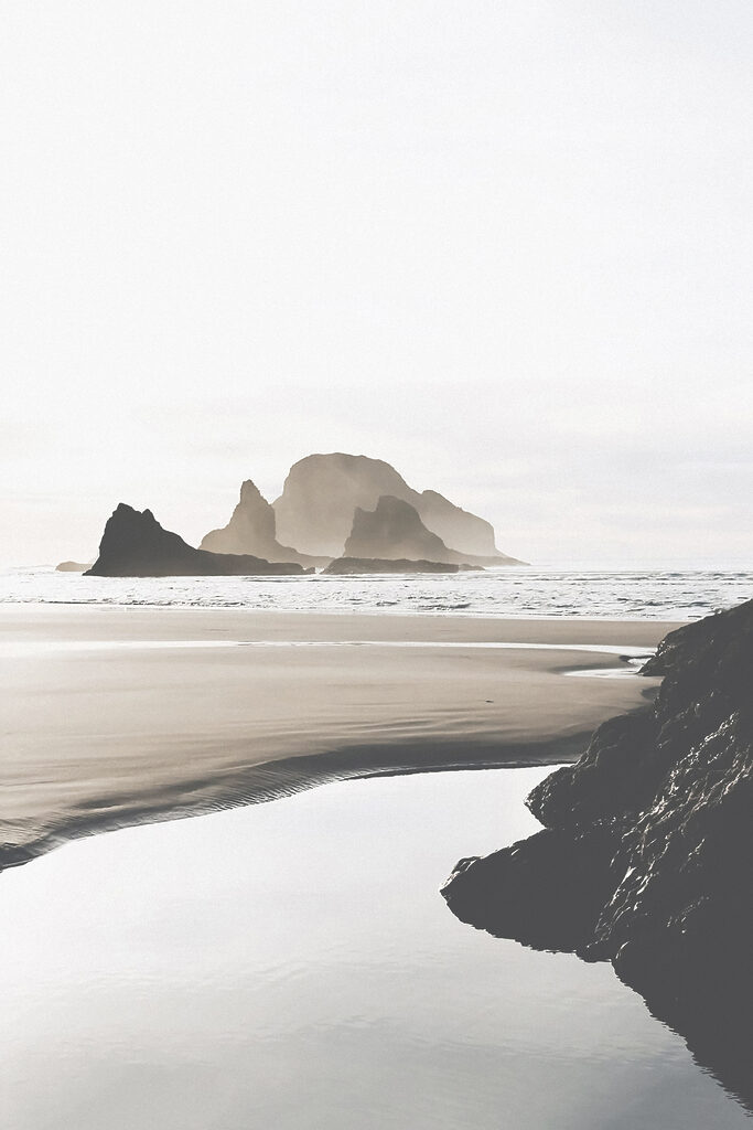 A beach with rocks and water