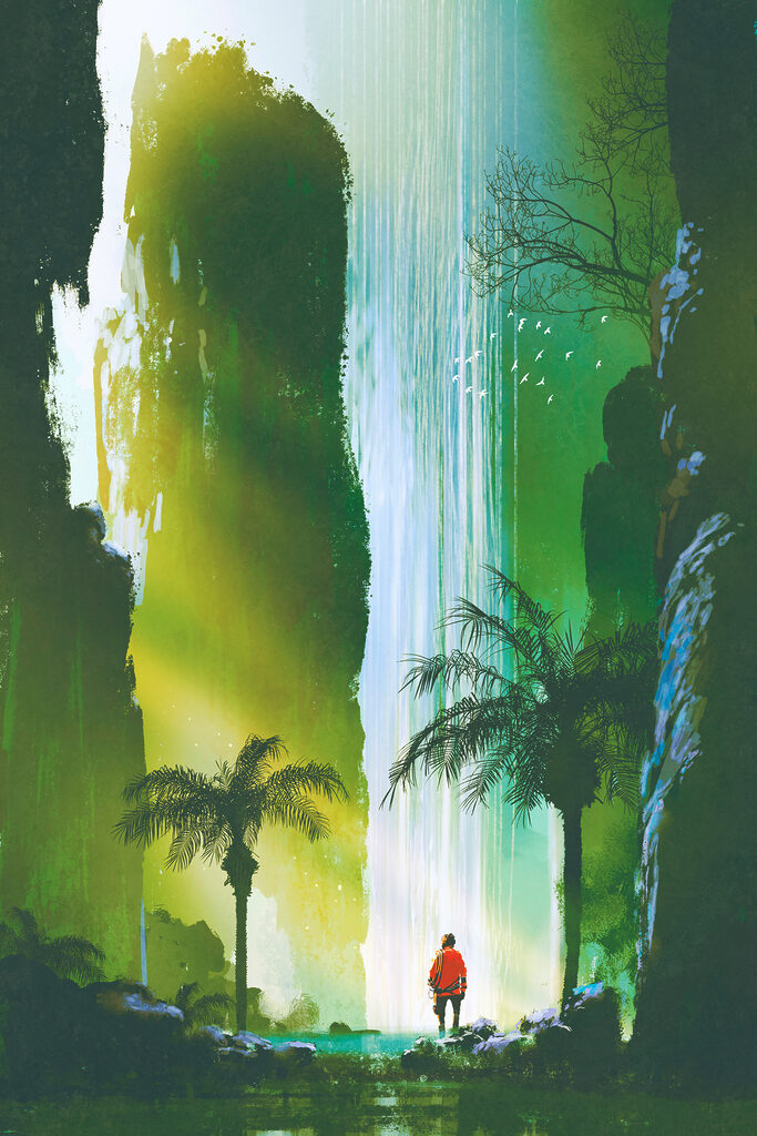 A man walking in a forest with a waterfall
