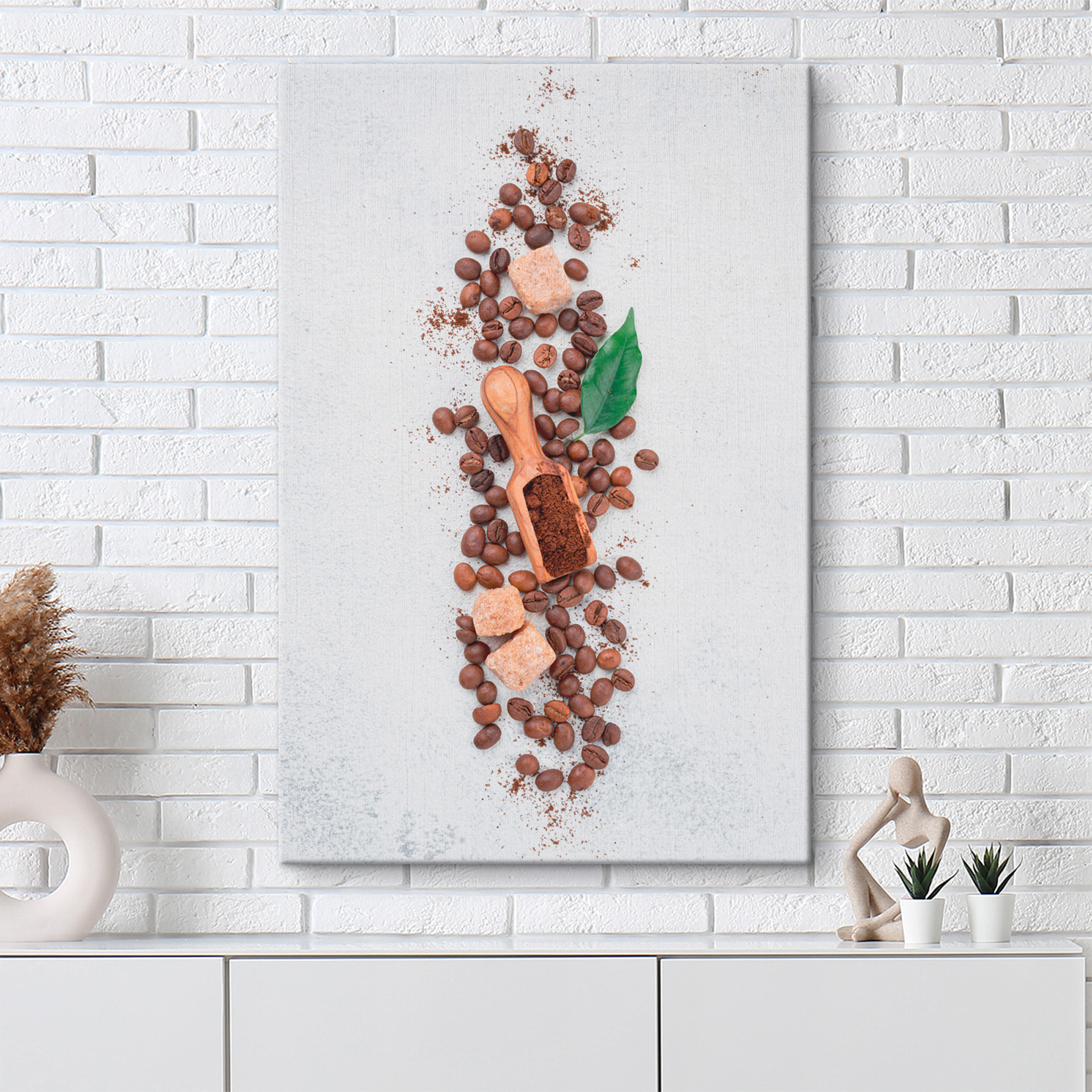 A spoon with coffee beans and sugar on top