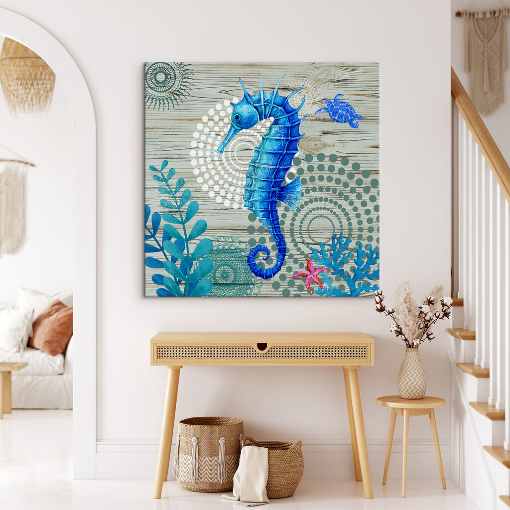 A blue seahorse and seaweed on a wood surface