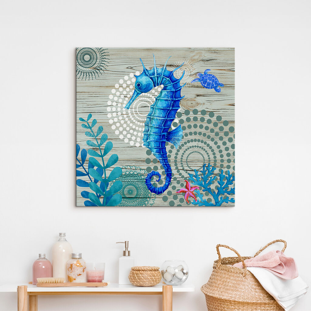 A blue seahorse and seaweed on a wood surface