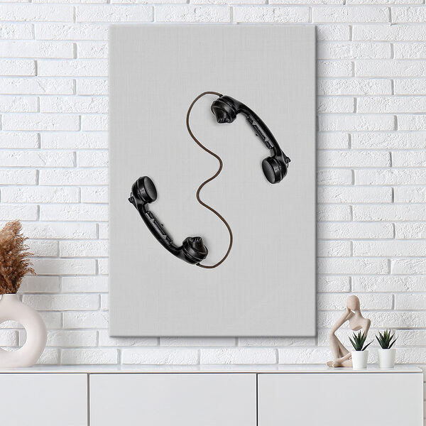 A pair of handsets with a cord A pair of handsets with a cord