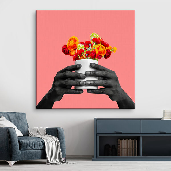 A black hands holding a white cup with flowers A black hands holding a white cup with flowers