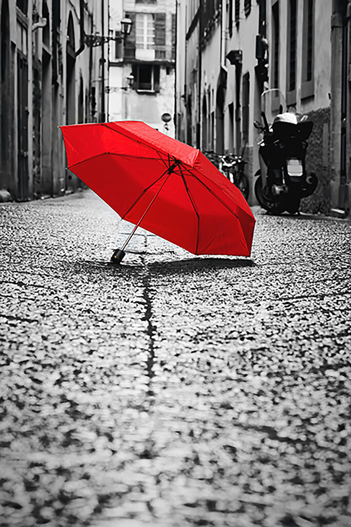 A red umbrella on a street A red umbrella on a street
