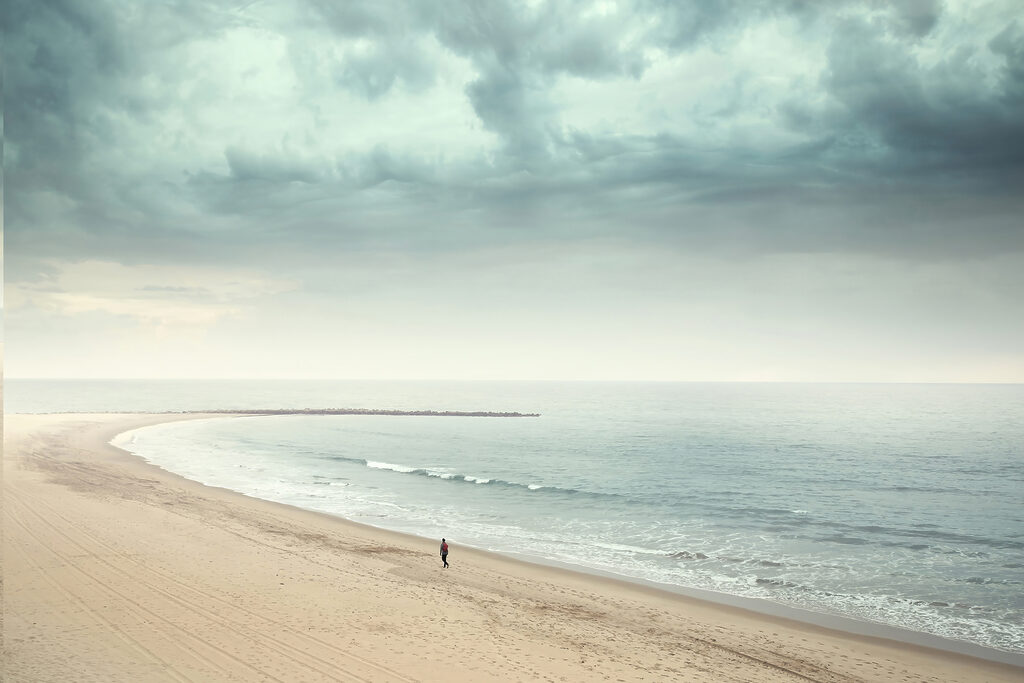 A person walking on a beach A person walking on a beach