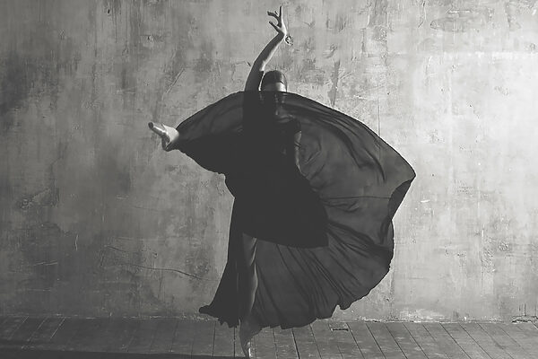 A woman dancing in a black dress A woman dancing in a black dress