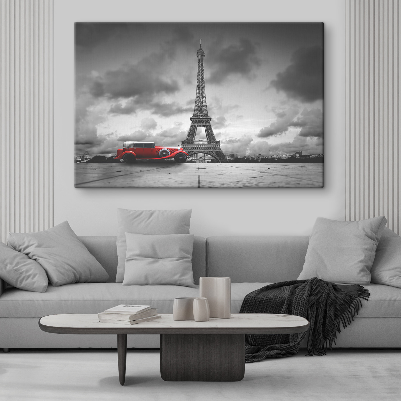 A red car parked in front of a large tower