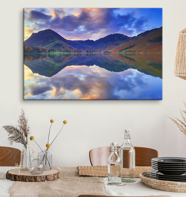 A lake with mountains in the background