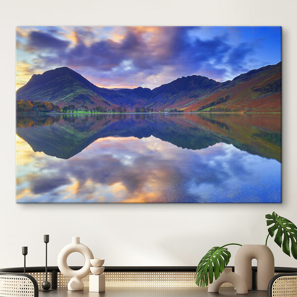 A lake with mountains in the background