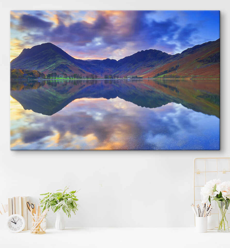 A lake with mountains in the background