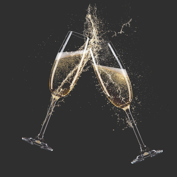 Two glasses of champagne with splashing liquid Two glasses of champagne with splashing liquid