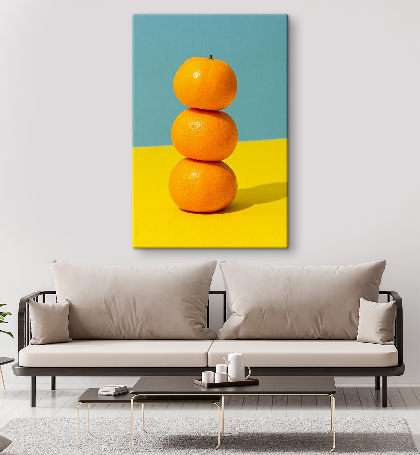 A stack of oranges on a yellow and blue surface