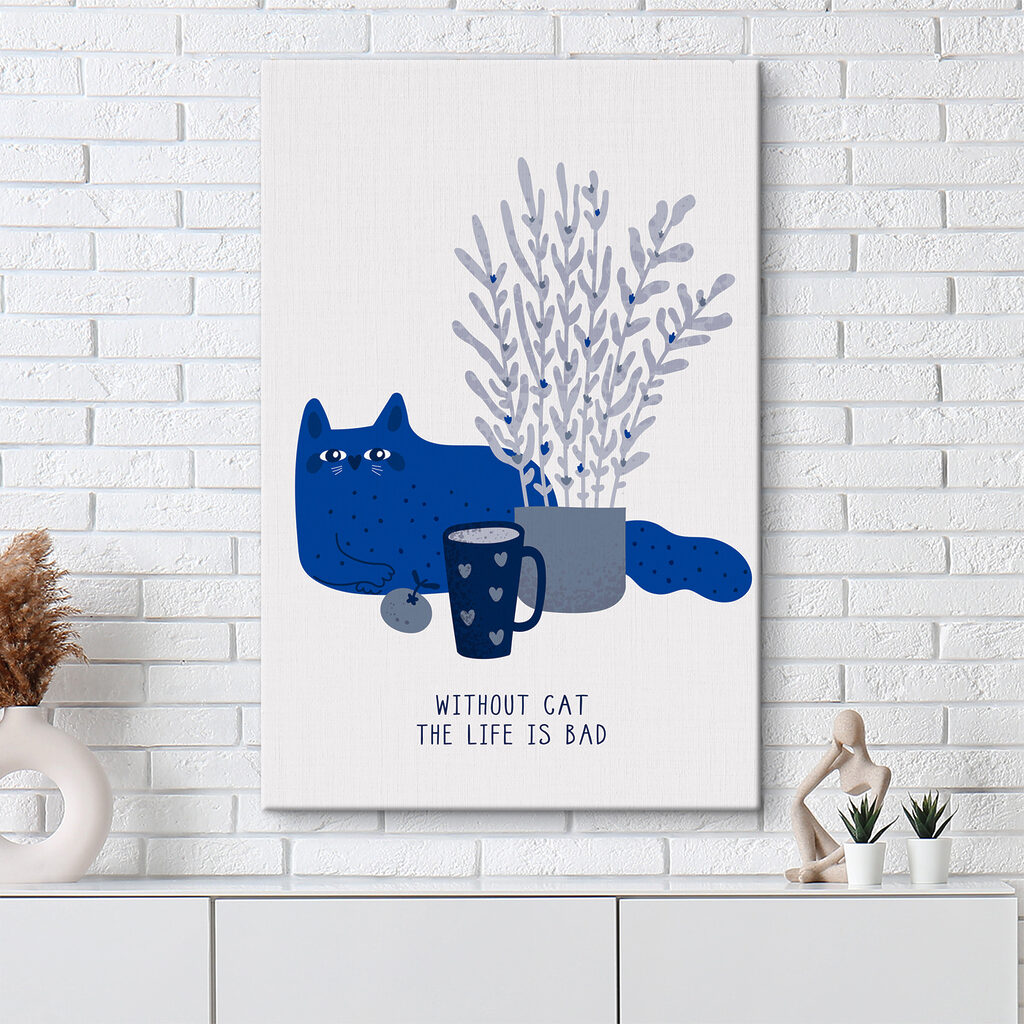 A cat sitting next to a cup and a plant