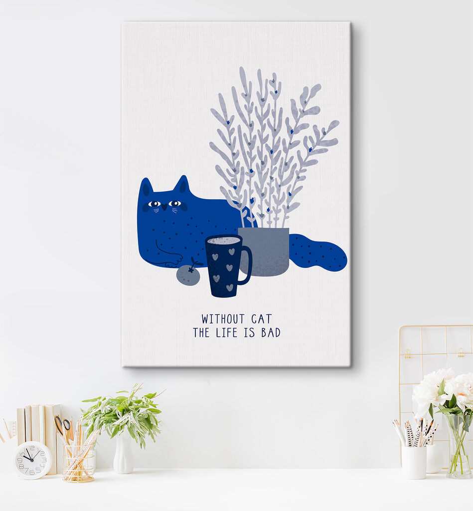 A cat sitting next to a cup and a plant