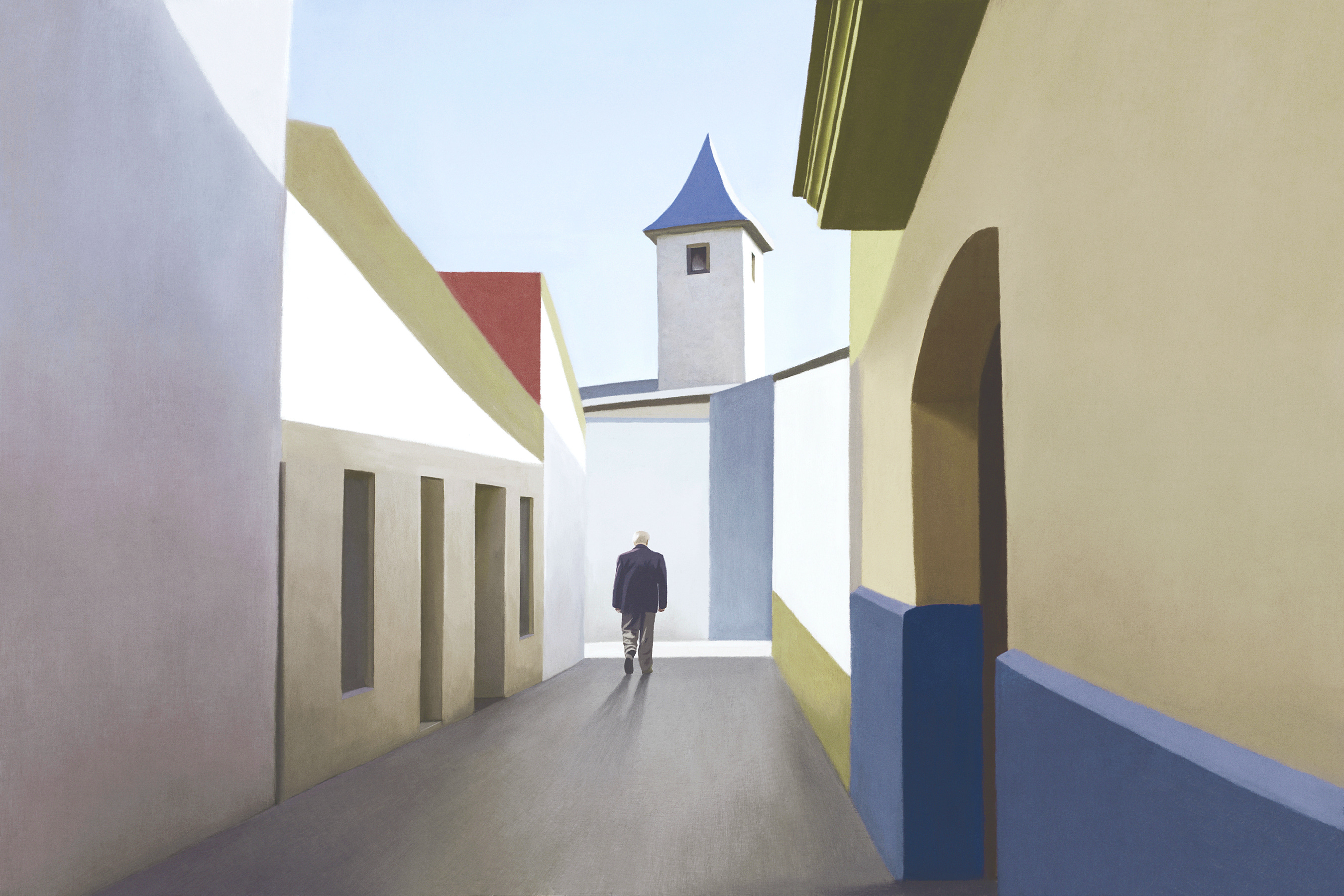 A man walking down a narrow street