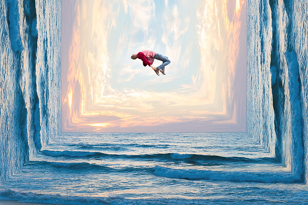 A man jumping in the air over water A man jumping in the air over water
