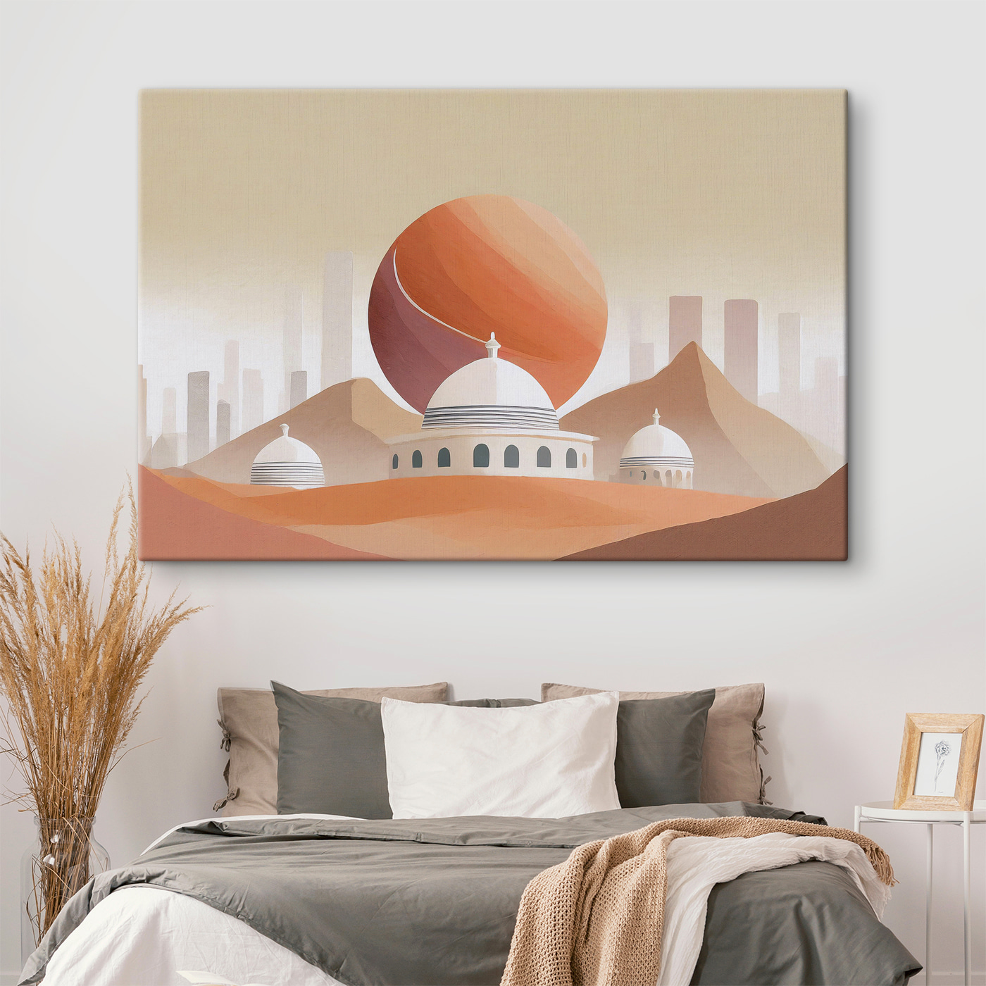 A desert landscape with buildings and a large red ball