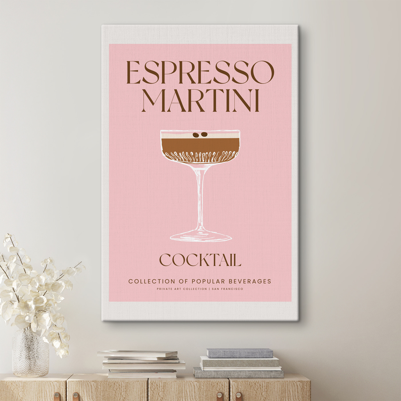 A pink and white sign with a glass of brown liquid A pink and white sign with a glass of brown liquid