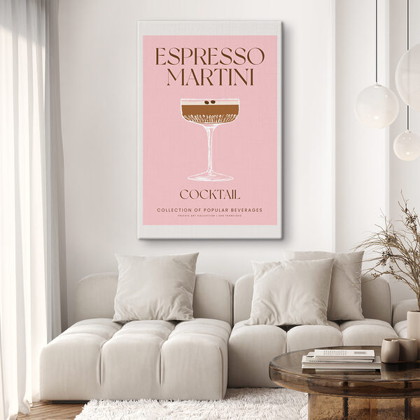 A pink and white sign with a glass of brown liquid A pink and white sign with a glass of brown liquid