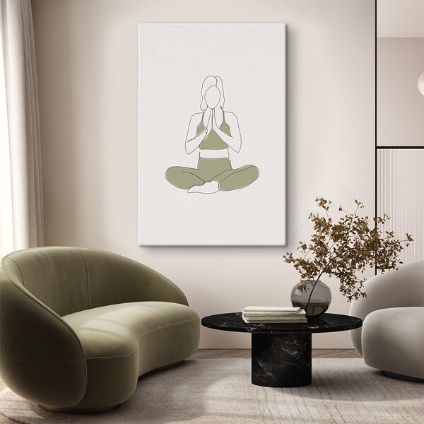 A woman sitting cross legged with her hands together