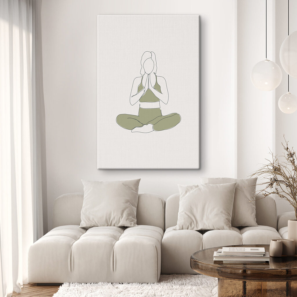 A woman sitting cross legged with her hands together